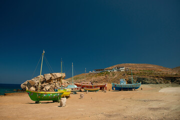 View at famous Pathos bar and painted colorful fishing boats near the sea