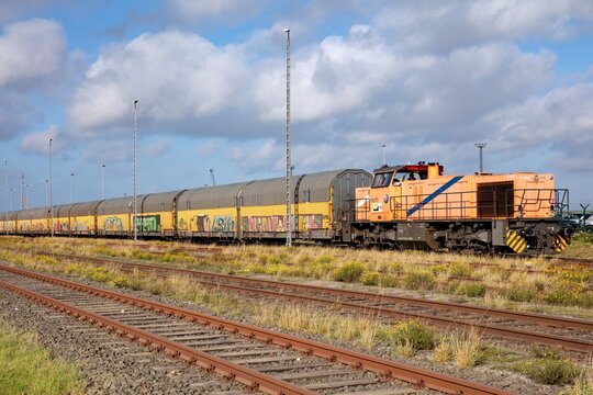 CUXHAVEN, GERMANY - OCTOBER 27, 2020: Freight train with northrail diesel hydraulic MaK / Vossloh G1206 locomotive.