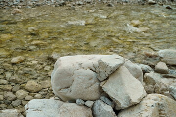 Macro photography of rocks in front of stream in Ammergauer Alps / forest