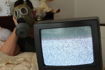 Anxious man watching tv static 
