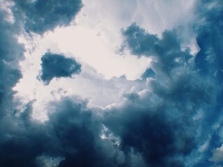 blue sky with rain clouds