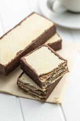 Crispy wafer biscuits filled with chocolate cream.