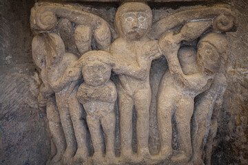 grabbing the hair in a possible fight, the girl with the braids roman capital, San Martín de Elines, Valderredible region, Cantabria, Spain