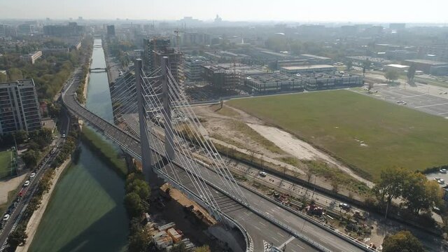 Aerial footage of a suspended bridge in Bucharest on a sunny day