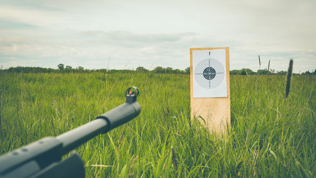 shooting a rifle at a target