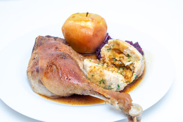 Goose drumsticks with bread dumpling and red cabbage