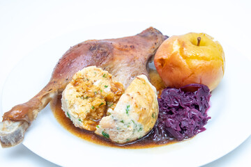 Goose drumsticks with bread dumpling and red cabbage