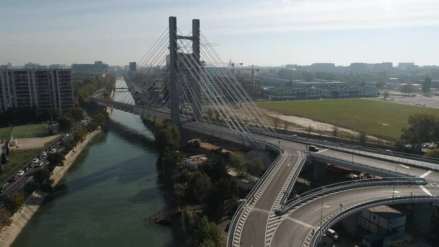 Aerial footage of a suspended bridge in Bucharest on a sunny day
