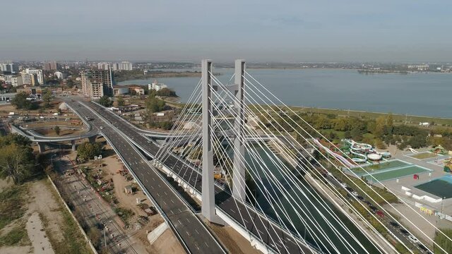 Aerial footage of a suspended bridge in Bucharest on a sunny day