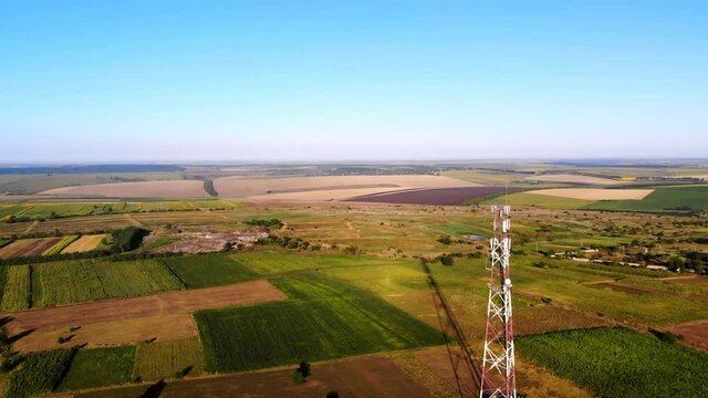 Aerial drone shot of hills and fields with wind turbines located near Donduseni in Moldova