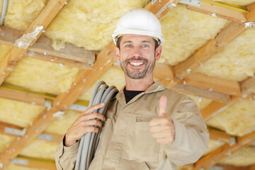 portrait of a builder with thumb-up