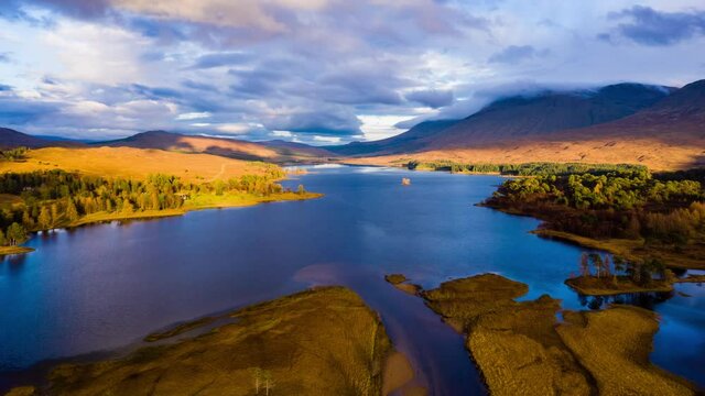 aerial drone shot over Loch Tulla in glen orchy near bridge of orchy in the argyll region of the highlands of scotland during autumn
