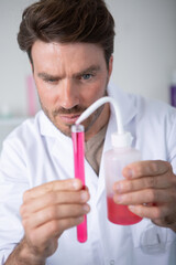 male scientist testing experiment in a science lab