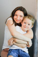 A mother hugs her child.
