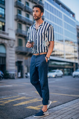 handsome man walking on the street