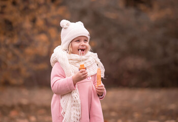 Girl, garden, pink coat, soap bubble blower, fun
