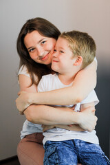 A mother hugs her child.