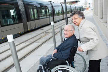 couple waiting to get in the tram