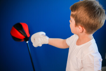 Young boy Boxing at home during self-isolation.