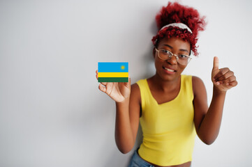 African woman with afro hair, wear yellow singlet and eyeglasses, hold Rwanda flag isolated on white background, show thumb up.