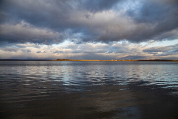 Fototapeta na wymiar autumn clouds over the lake