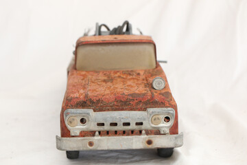 Early 1960s Vintage Red Number 5 Fire truck that has rusted out and seen better days