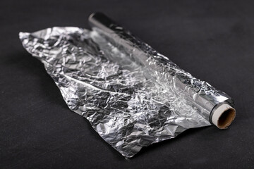 Aluminum foil wound on a cardboard roller. Material used to store food.