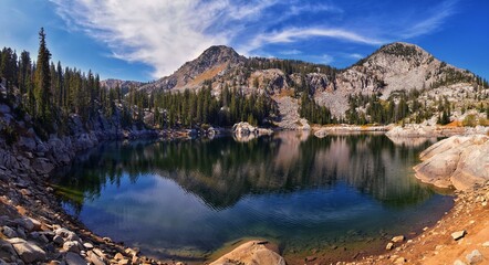 Fototapeta premium Lake Mary panorama views from hiking trail to Sunset Peak on the Great Western Trail by Brighton Resort. Rocky Mountains, Wasatch Front, Utah. United States. 