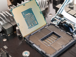 the process of connecting the CPU to the processor socket on a modern computer motherboard,...