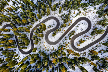 Aerial drone view of windy road during winter