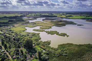 Drone aerial of backwater lake in Morag, small town in Warmia Mazury region of Poland - obrazy, fototapety, plakaty