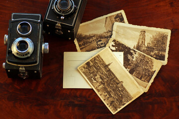 Old, vintage TLR camera - twin lens reflex and old postcards 