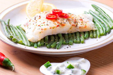 Fresh cod with green beans and chilli