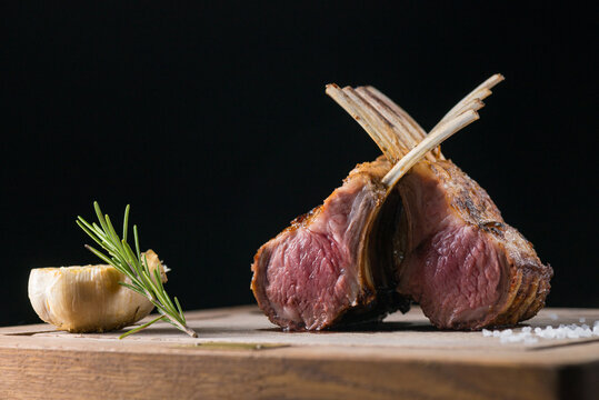 Rack of lamb lamb chops with rosemary freshly cooked on a grill