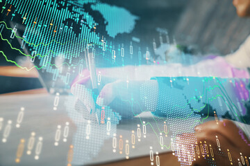 Double exposure of forex chart drawing over people taking notes background. Concept of financial analysis