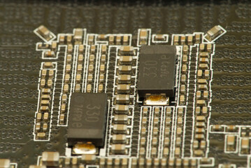 various chips on a textolite video card board for a modern desktop computer