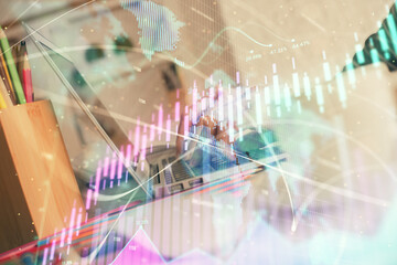 Naklejka premium Double exposure of woman hands typing on computer and forex chart hologram drawing. Stock market invest concept.