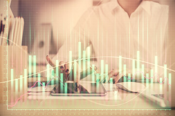 Double exposure of forex chart sketch hologram and woman holding and using a mobile device. Financial market concept.