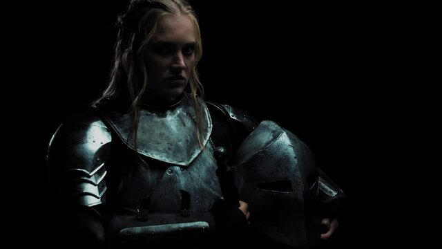 Angry female warrior in medieval metal armor, tough women, 4k