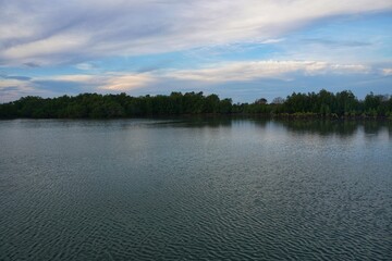 Natural blue sea in the territory of Indonesia there are trees and blue clouds.