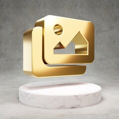 Images icon. Shiny golden Images symbol on white marble podium.