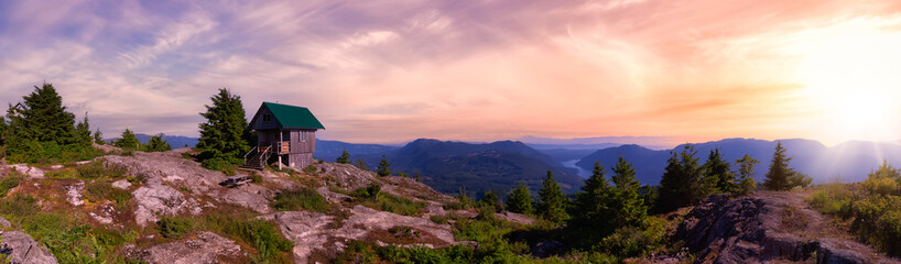 Naklejka na ściany i meble View of Tin Hat Cabin on top of a mountain. Dramatic Colorful Sunset Art Render. Located near Powell River, Sunshine Coast, British Columbia, Canada.