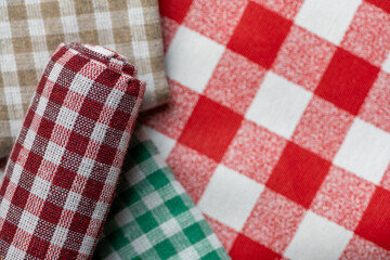 Colorful checkered tablecloths, top view.