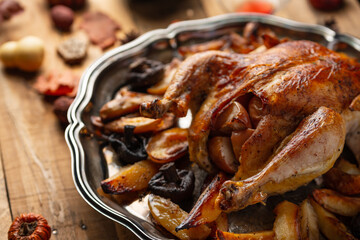Close-up view of dish with baked turkey, potato and mushrooms for Thanksgiving or Christmas festive dinner. Traditional recipe. Concept of tasty homemade food.