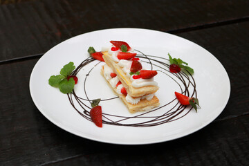 Strawberry Mille Feuille cake in white plate.