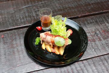 Beef Patty and suki steak in black plate.