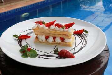 Strawberry Mille Feuille cake in white plate