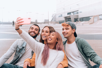 group of multicultural happy friends takes a selfie.