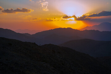 mountain sunset with dramatic clouds
