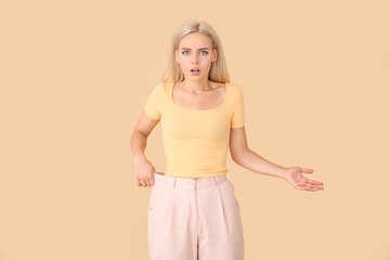 Woman with sudden weight loss problem on color background. Diabetes symptoms